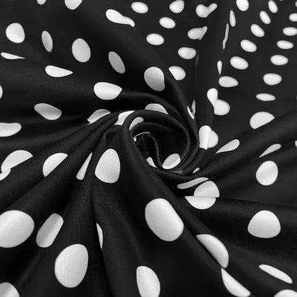 Multicolour polka dot dress with square collar, short sleeves, zip front, and pleated mid-length skirt.