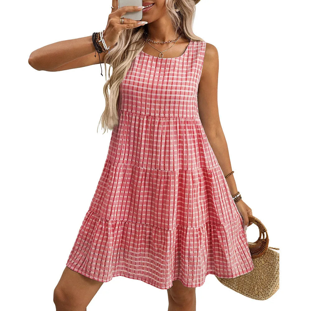 Women's light blue sleeveless plaid dress with an oversized swing skirt and high waist.