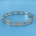 Women's hollow bracelet with four-leaf clover pattern and zircon stones in gold or silver finish