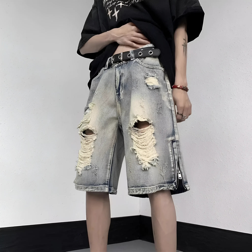 Blue denim shorts with wide leg cut and tattered retro detailing