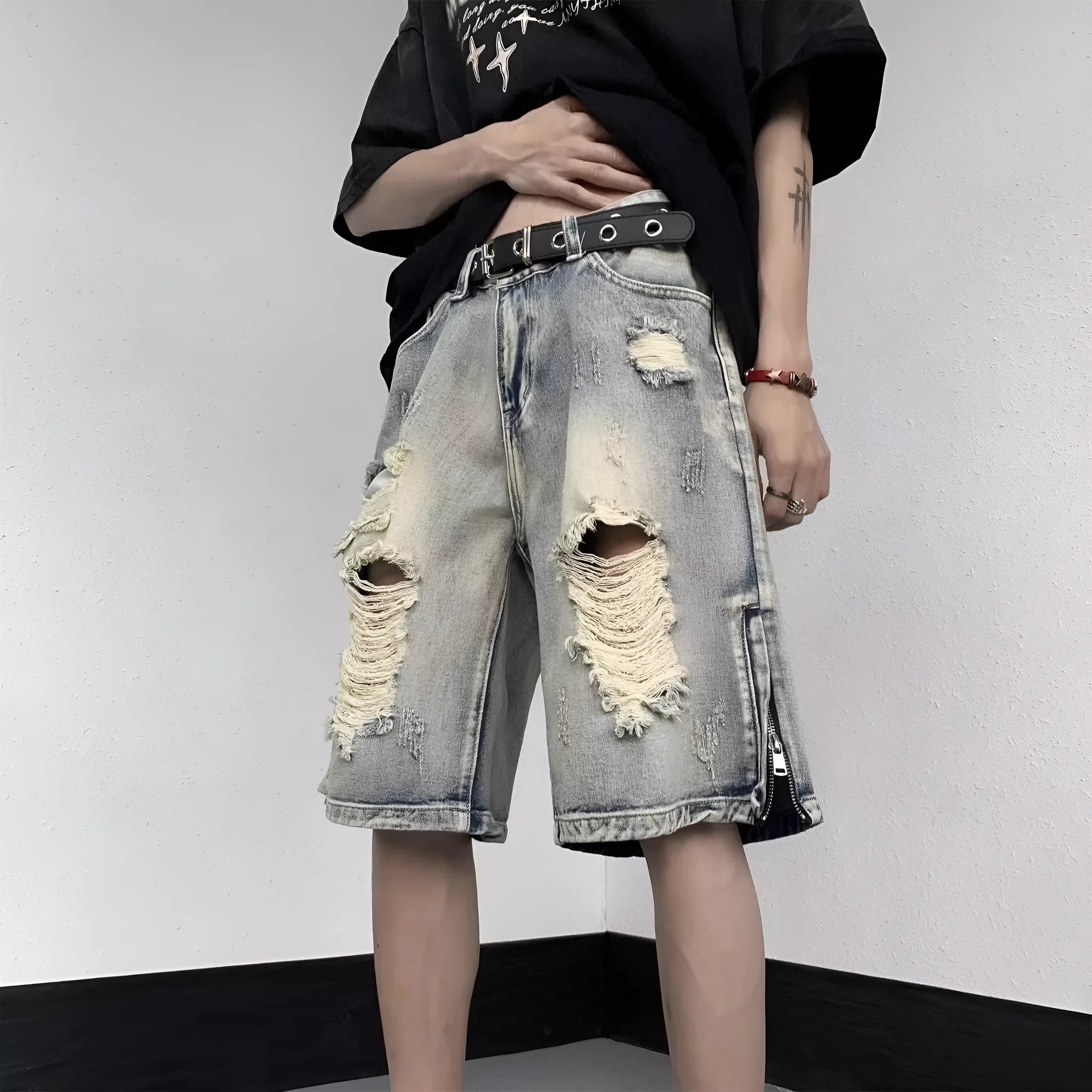 Blue denim shorts with wide leg cut and tattered retro detailing