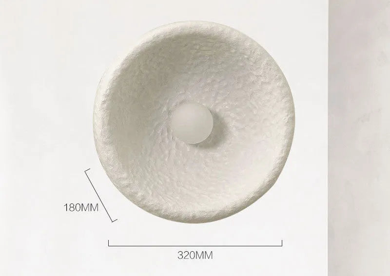 Japanese-style simple silent wall lamp with resin shade in warm white light.