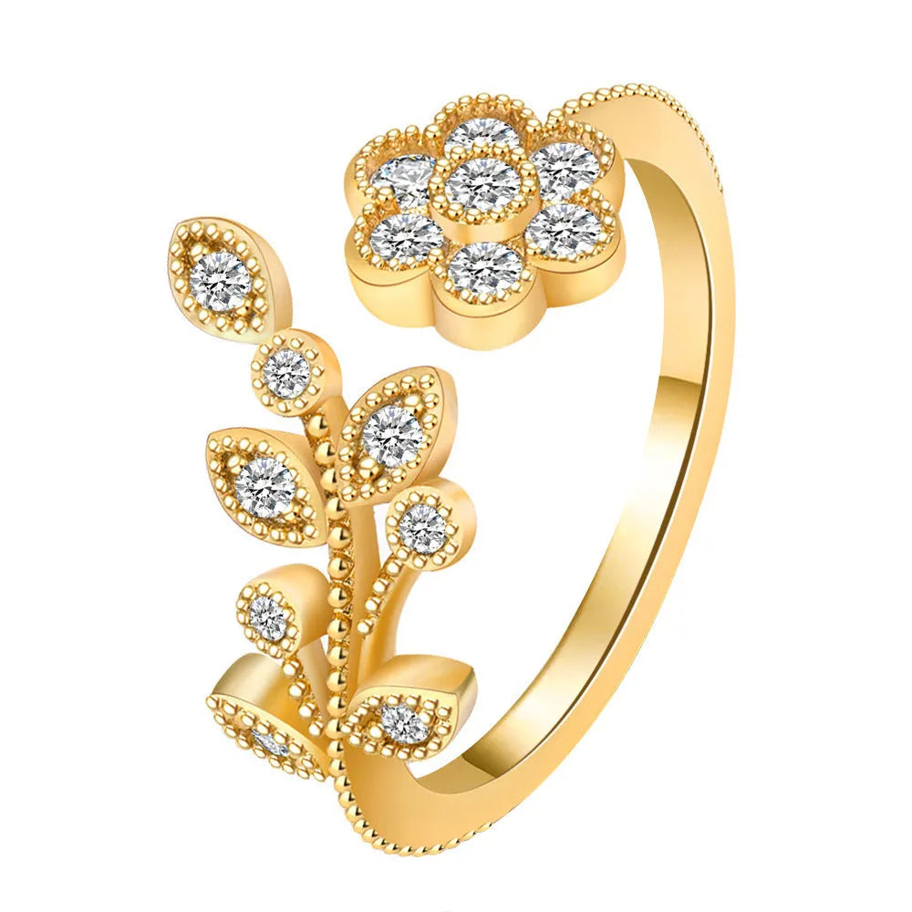 Gold and white copper open ring with diamond-finished flower and leaf design for women.