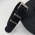 Nylon quick-release watch strap in army green, showing the integrated spring bar mechanism.