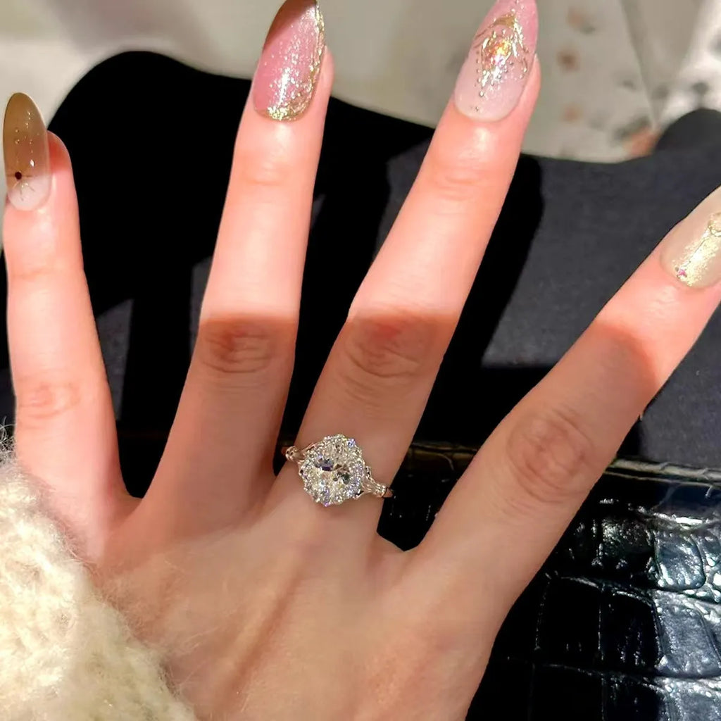 Silver geometric bridal bouquet ring with adjustable opening on index finger