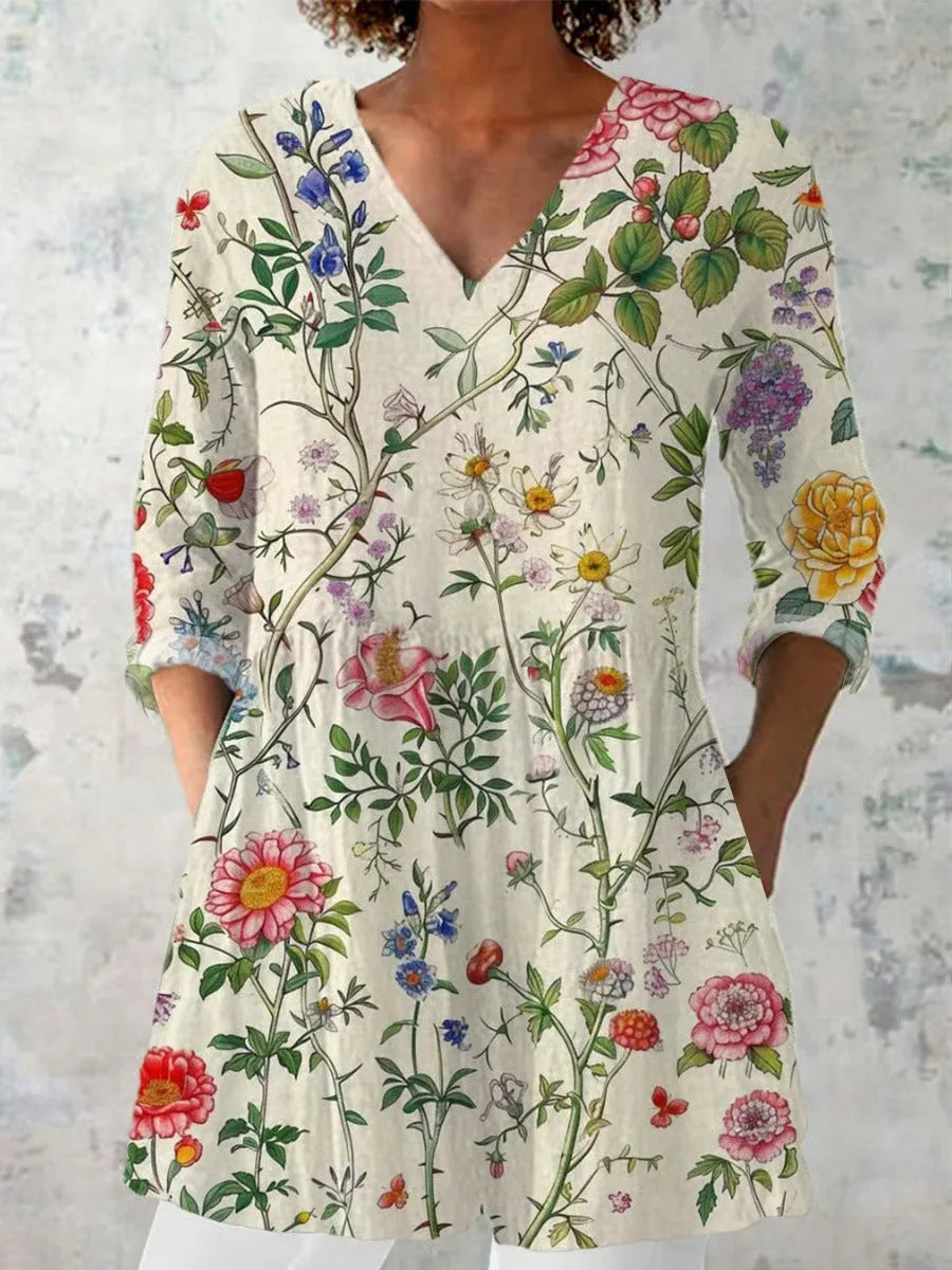 Women's slim-fit long-sleeved retro top with a digital print design on polyester fabric.