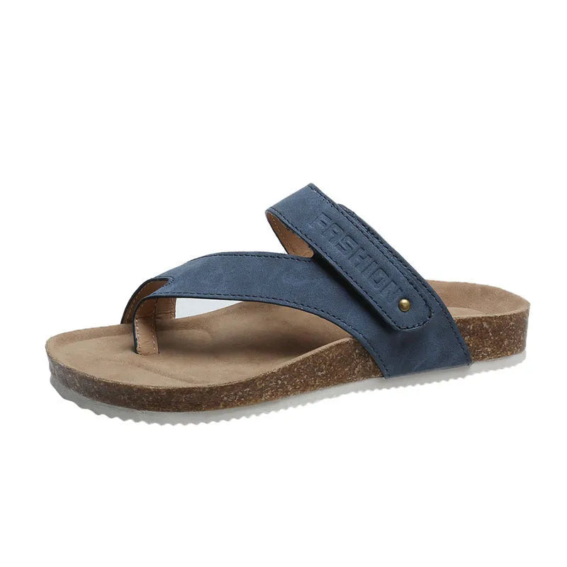 Flat toe ring thick-soled flip-flops in a solid colour on a light background