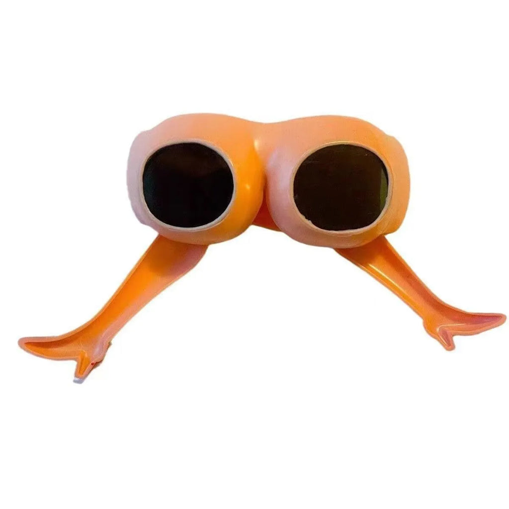 Orange plastic novelty sunglasses with leg and hip design measuring 15x20cm