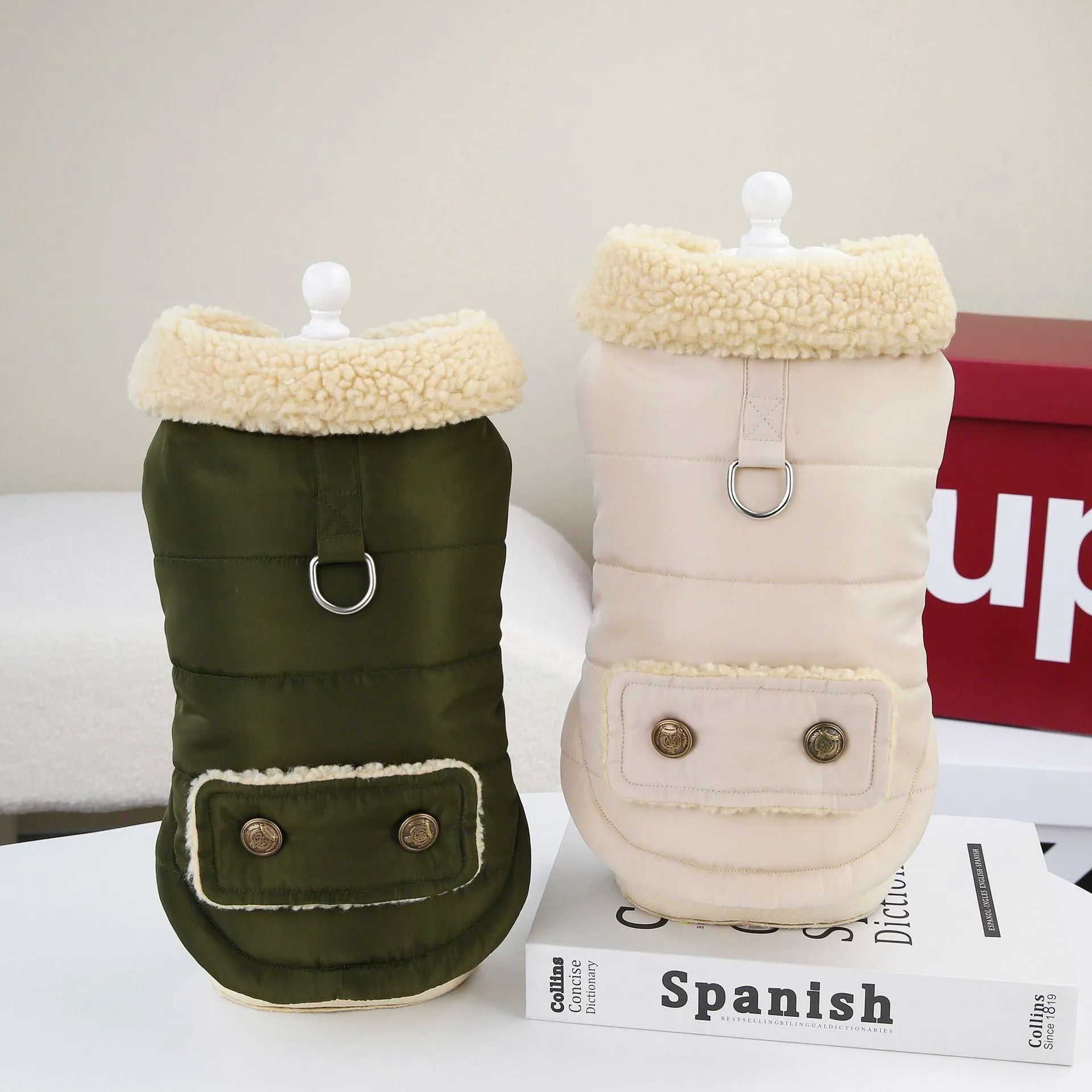Teddy Cat Nordic fur collar cotton vest in green, draped on a surface showing fur collar and button closures