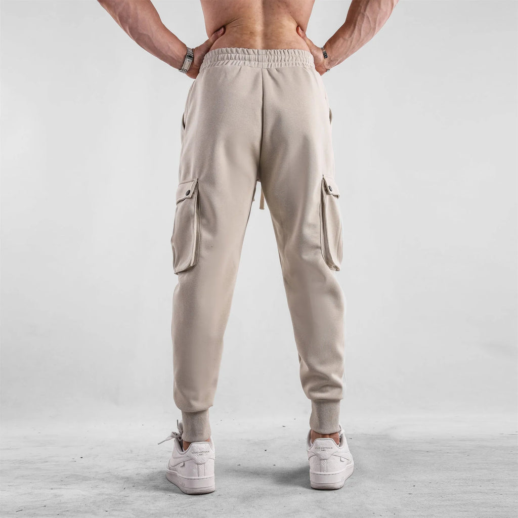 Men's loose cotton trousers with ankle tie fastening and multiple pockets in six colour options