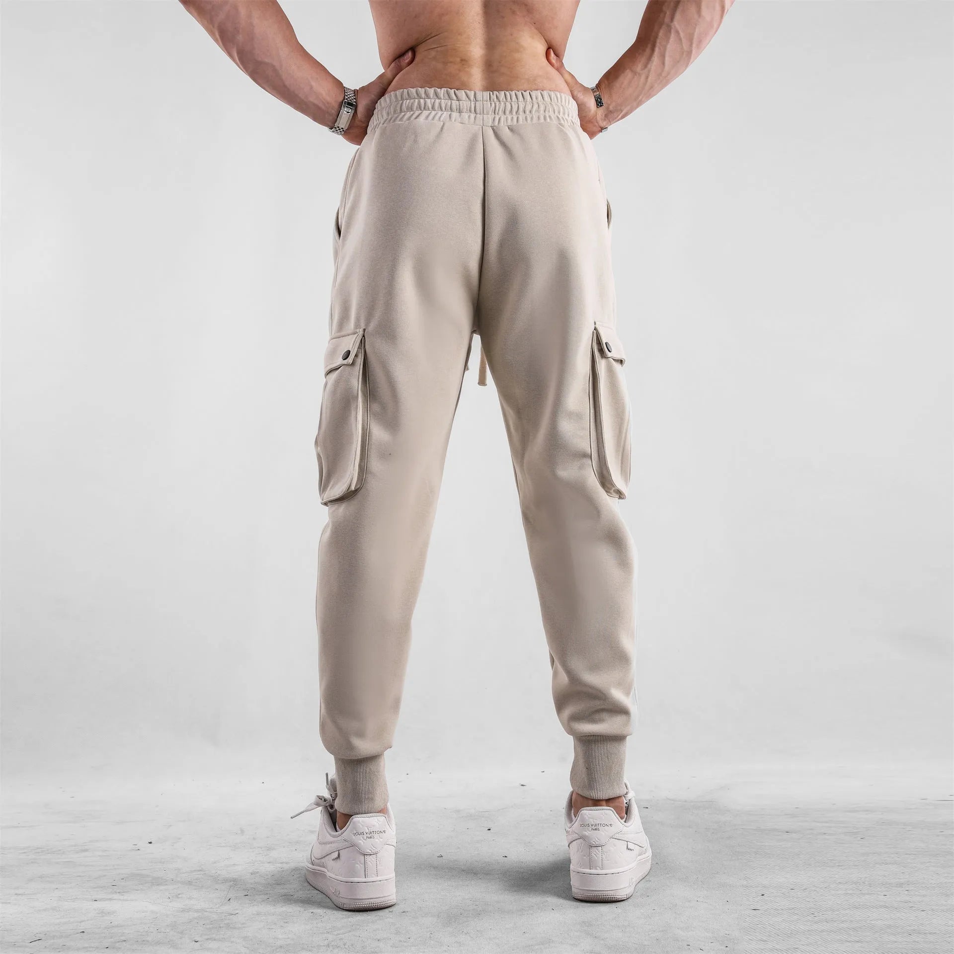 Men's loose cotton trousers with ankle tie fastening and multiple pockets in six colour options
