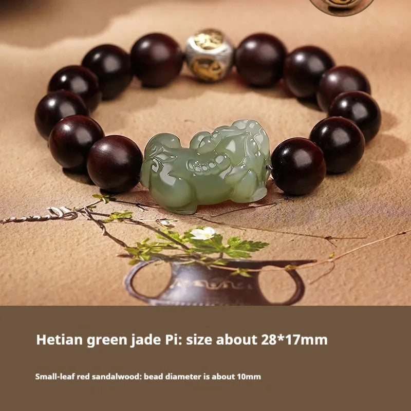 A Hetian jade bracelet with braided black and red rope in a Chinese style design.