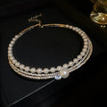 Women's curved geometry necklace highlighting collarbone with electroplated silver finish and alloy construction
