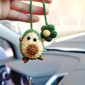 Handmade crocheted wool car pendant with rainbow colours hanging from car mirror