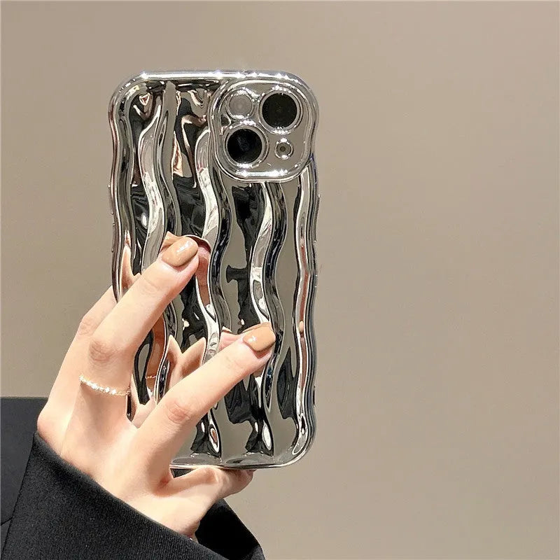 Silicone iPhone case with water ripple texture in green, shown on an iPhone 17 model