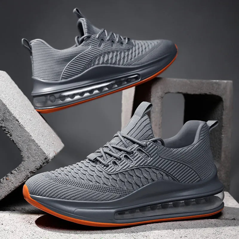 Men's black low-top mesh running shoes with round toe and lace-up front on a white background.