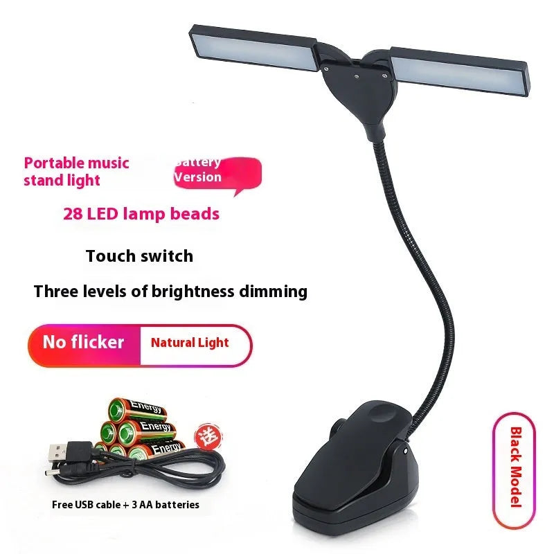 Rechargeable black music stand light with 28 lamps and USB cable on a music stand.