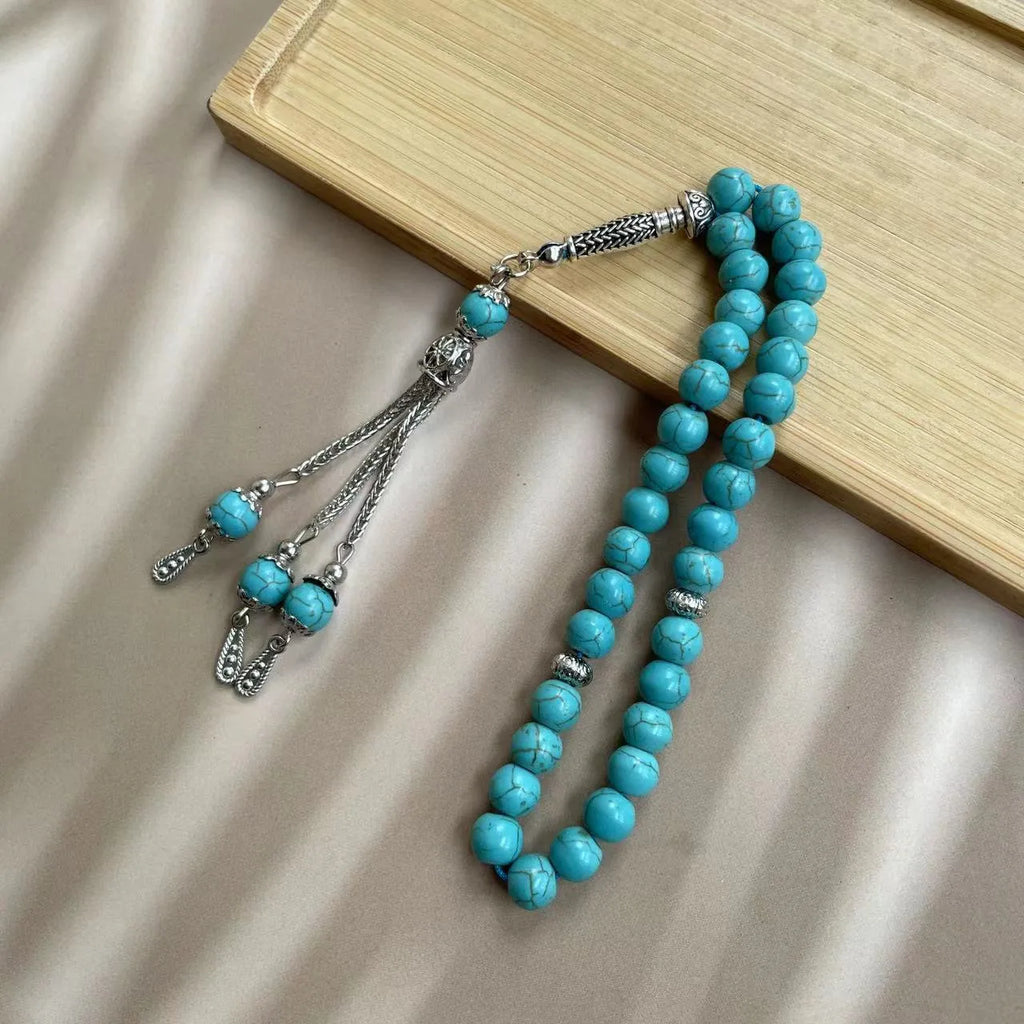Sky blue natural stone bead Muslim prayer bracelet with 8mm spherical beads on a cord.