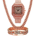 Gold Roman numeral square dial watch with diamond studs and mesh band, part of a three-piece jewellery set.