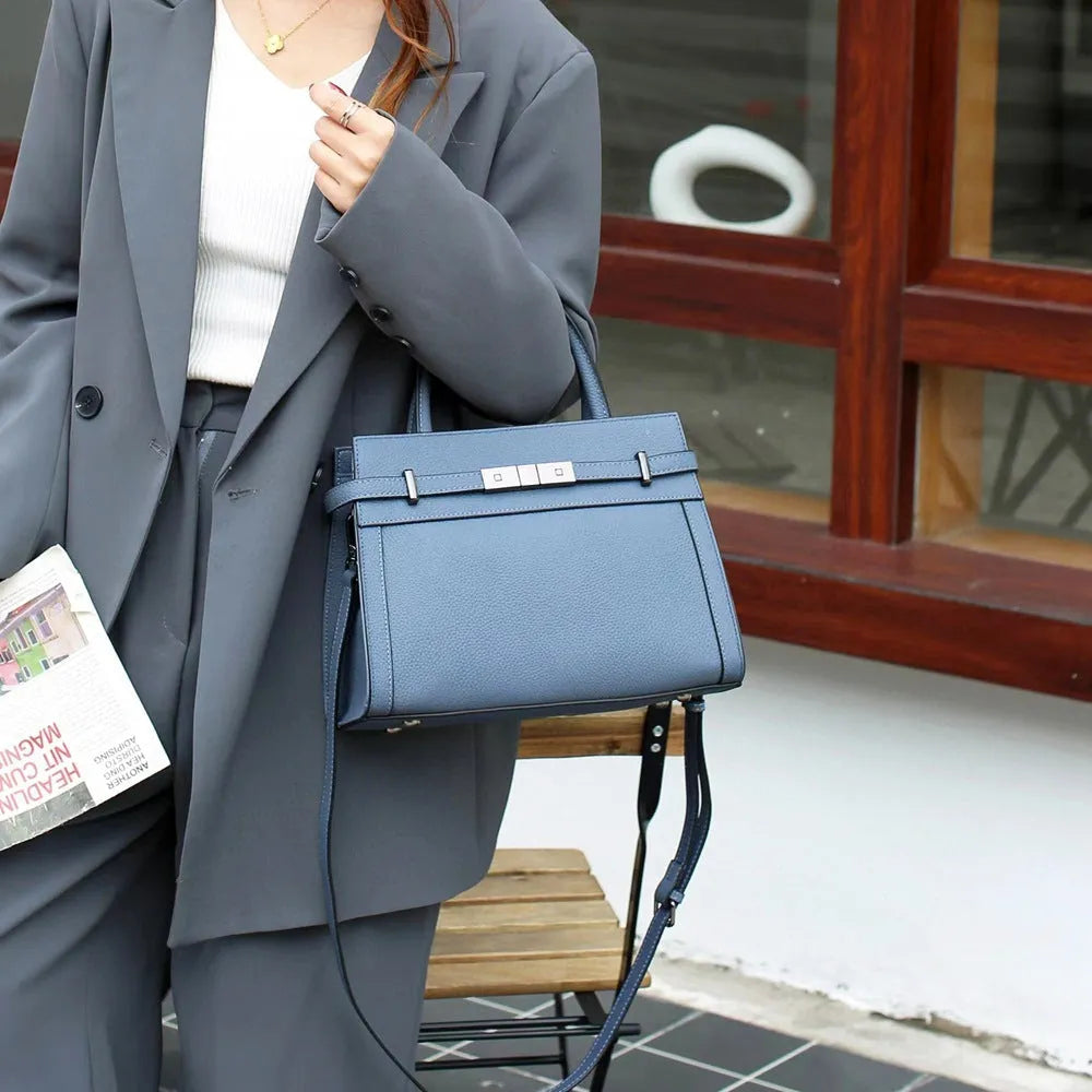 Small square genuine leather shoulder bag in almond green with sandwich pocket exterior