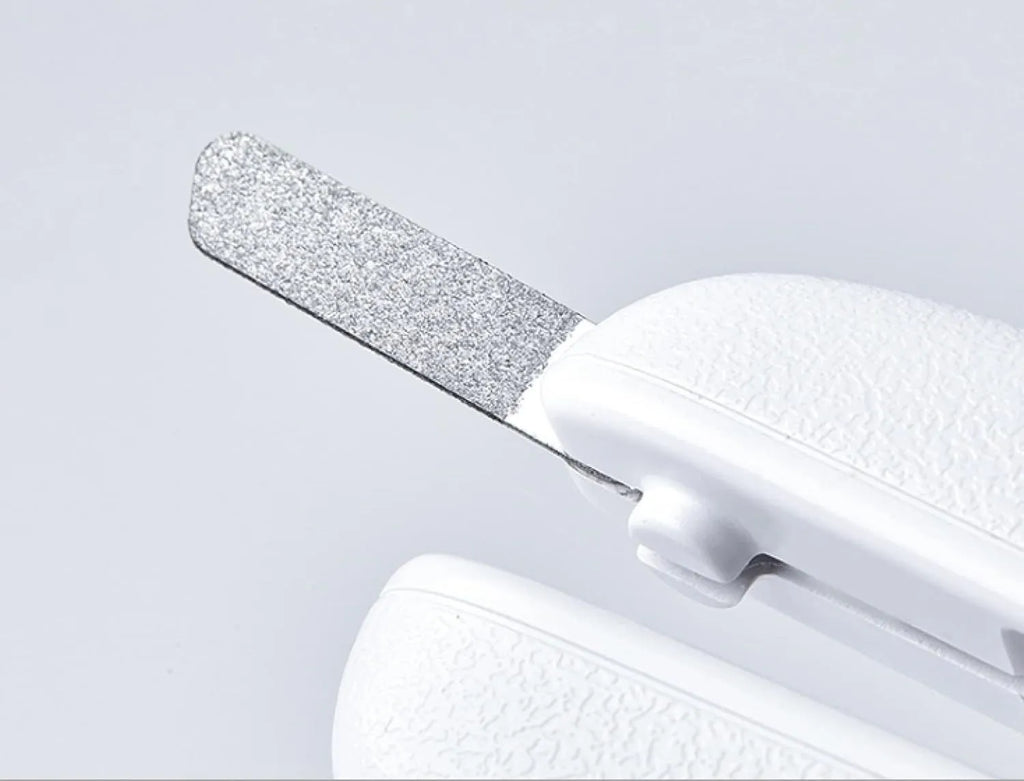 White pet nail clippers with LED light, transparent anti-splash guard and triangular blade for dogs and cats