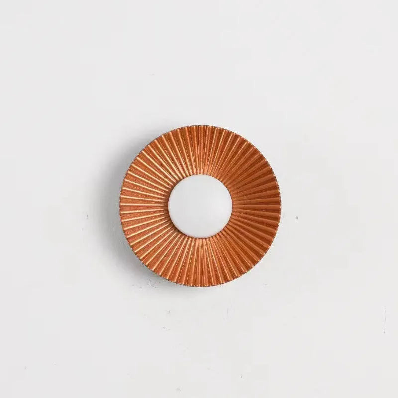 Round aluminium wall lamp with LED light in a choice of colour finishes including white and gold.