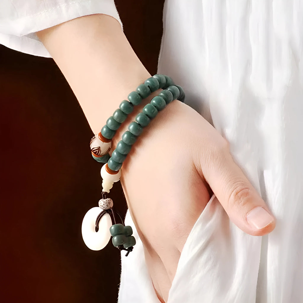 White jade bodhi seed bracelet with green sandalwood tones and double ring safety buckle clasp