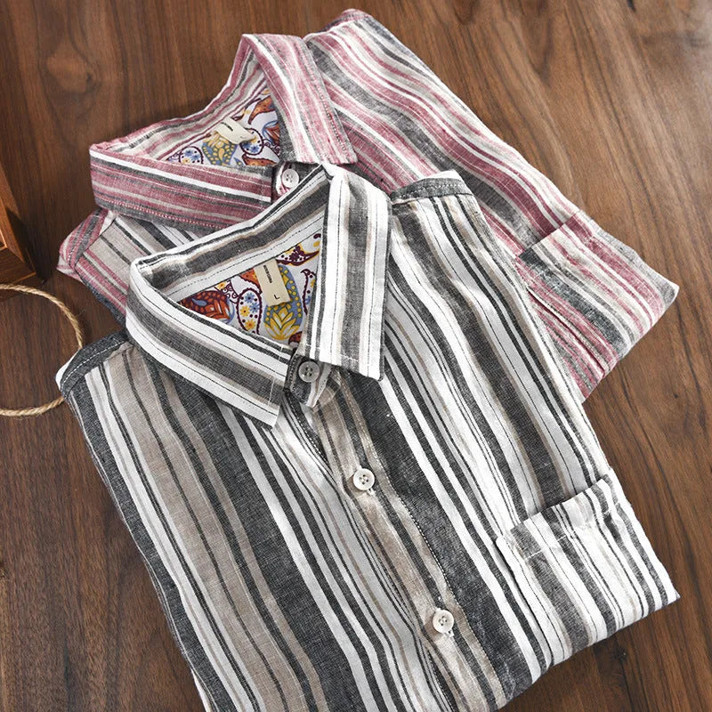Red and grey striped linen shirt for men on a hanger, showing long sleeves and loose casual fit.