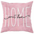 45cm square cherry blossom print cushion cover in short velvet fabric on a grey sofa.
