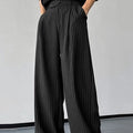 Black men's casual trousers with vertical stripes and pleated design on mannequin