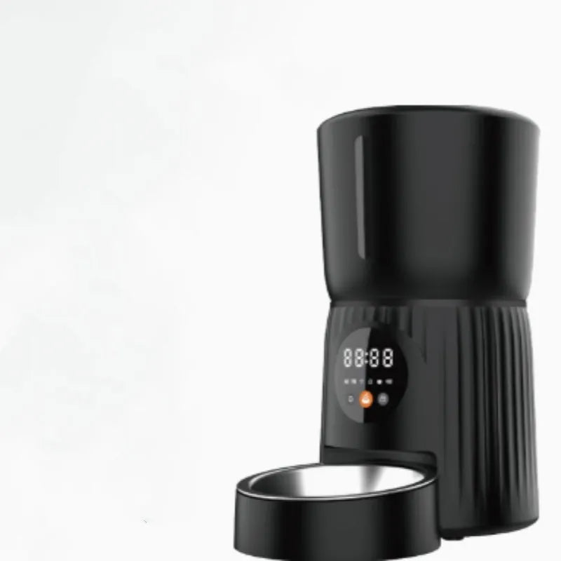 Black intelligent pet feeder with USB cable connection and food dispenser opening