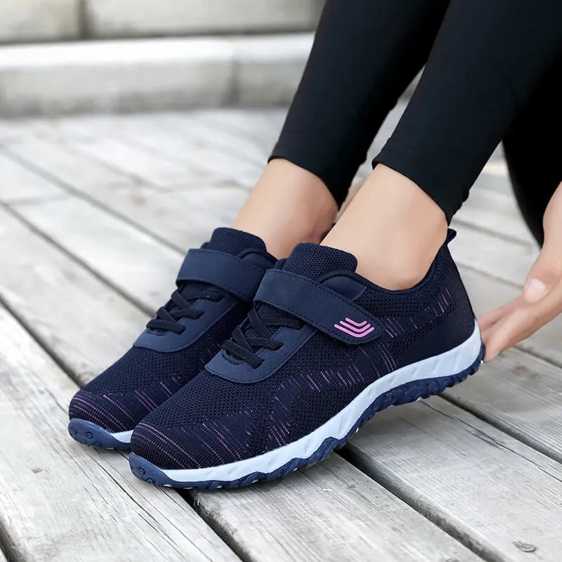 Women's low-top wedge heel shoes in grey purple with breathable mesh upper and Velcro strap.