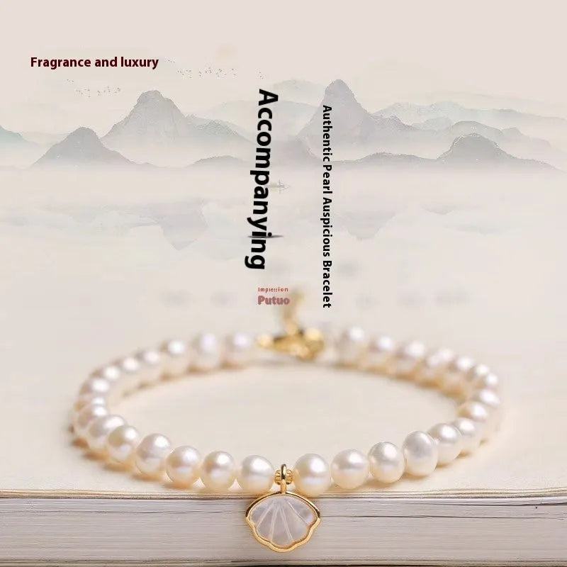 A women's freshwater pearl bracelet with a fan-shaped design, shown in 16cm length with elastic and chain options.