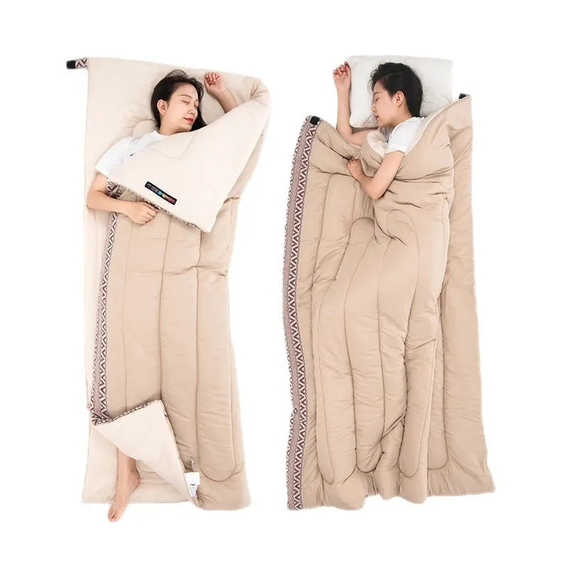 Four seasons camping sleeping bag in swamp colour, shown with its storage bag.