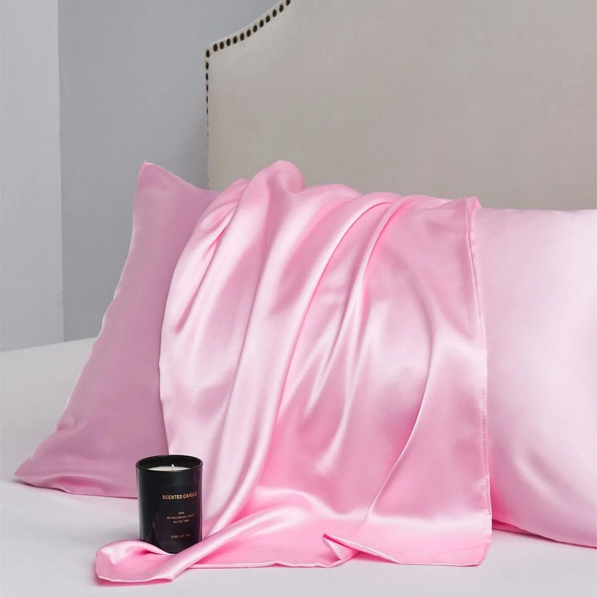 Pair of solid colour satin cloth pillowcases in polyester fibre available in twelve colours and four sizes