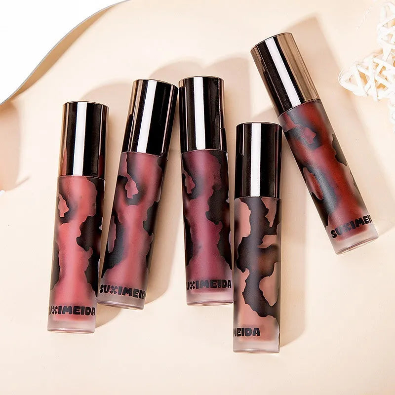 Matte lip mud lipstick tube showing five colour shades including orange brown coffee and cool grey