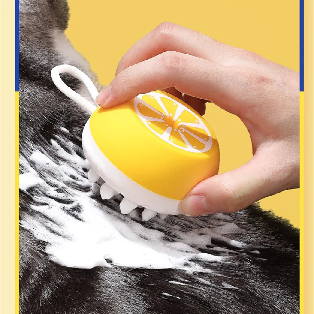 Yellow silicone pet bath brush with massage head design for dog and cat grooming during bath time