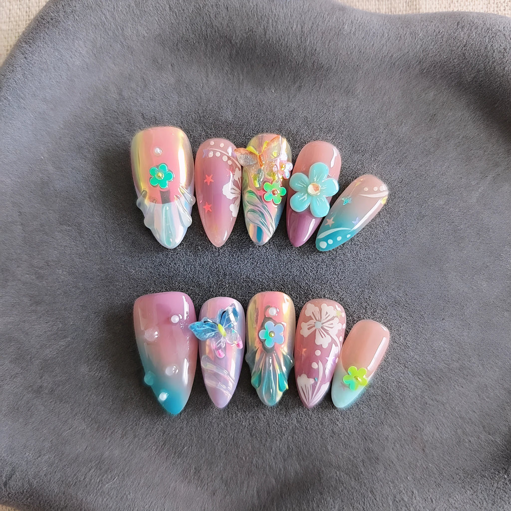 Handmade colourful manicure sculptures with floral butterfly designs for almond-shaped nails
