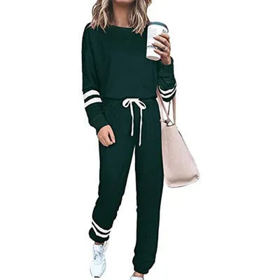 Women's plus size casual suit set in loose-fitting design with half-sleeve top and solid colour trousers