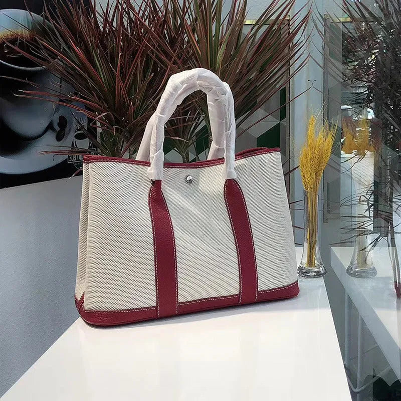 Genuine leather women's crossbody tote bag with canvas lining in bucket shape