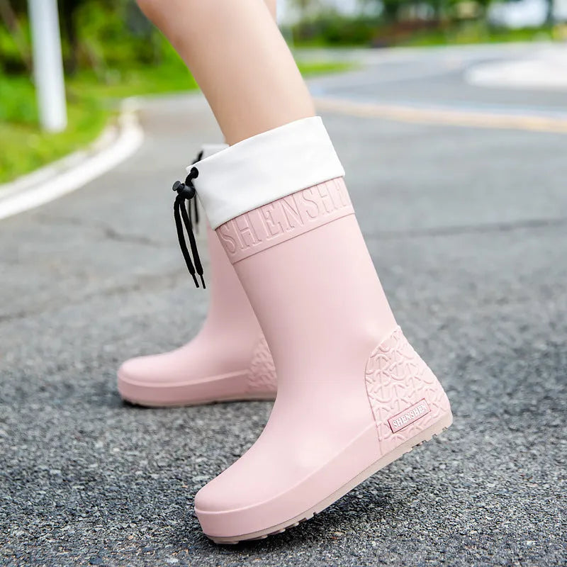 Women's PVC rain boots in solid colours with non-slip soles and waterproof mouth design