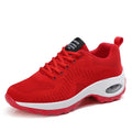 Women's black mesh sneakers with round toe and front lace-up closure showing flat heel design