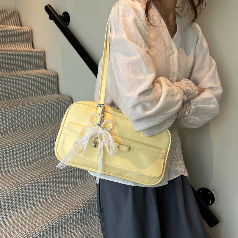 Women's black PU leather single-shoulder flap bag with a phone pocket and double-joint straps.