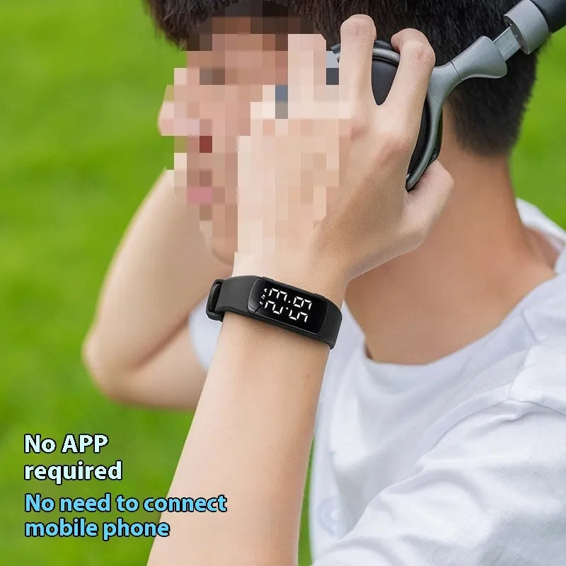 Vibration alarm clock watch with LED display on silicone strap showing multiple colour options