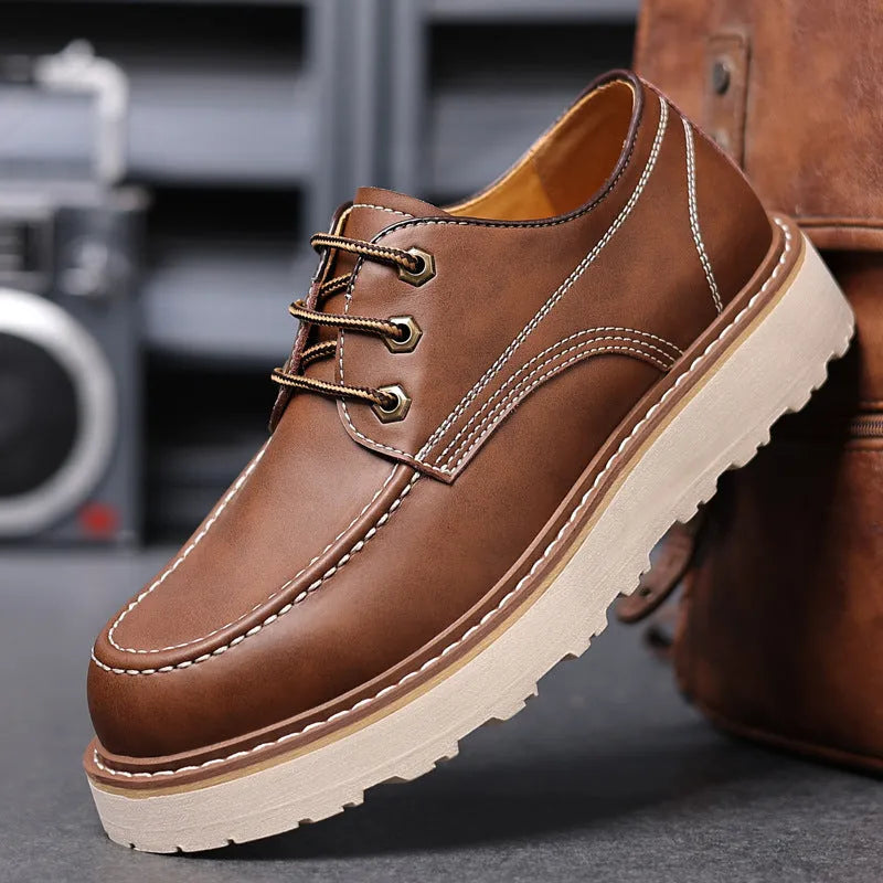 Men's black retro low-top Martin boots with a round toe and rubber sole.