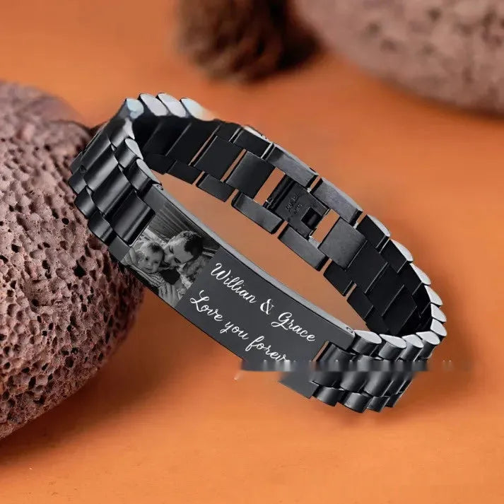 Men's stainless steel heart-shaped bracelet with engraved lettering options on wrist