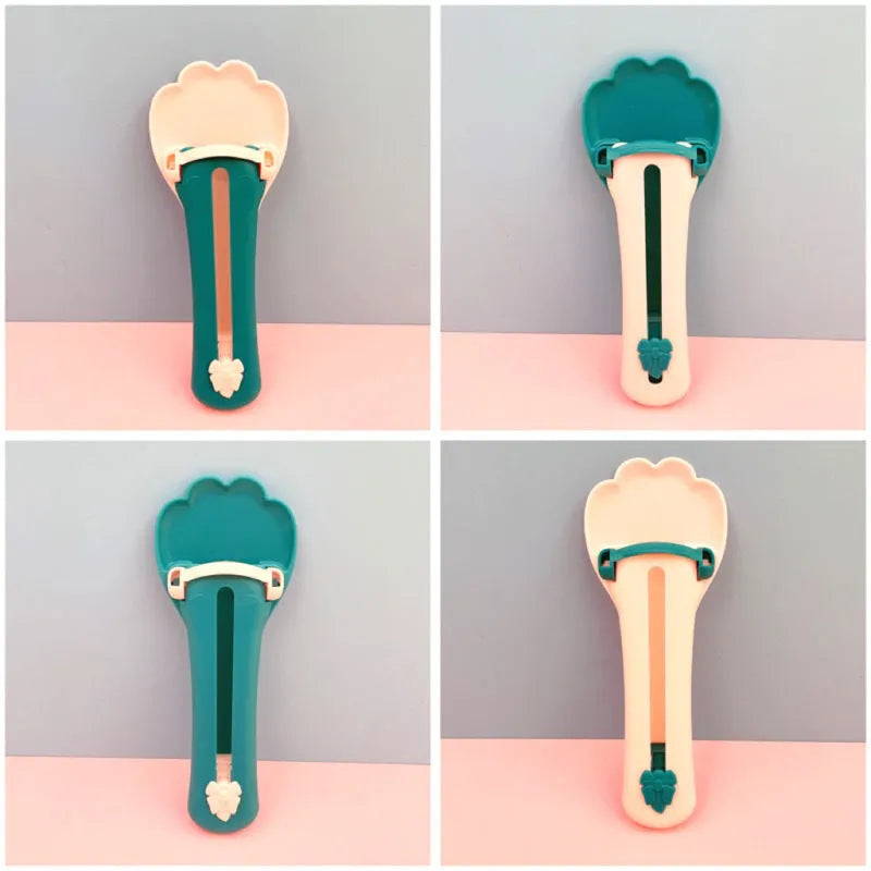 Green and pink pet feed spoon with silicone barrel for squeezing out sticky dog or cat food.