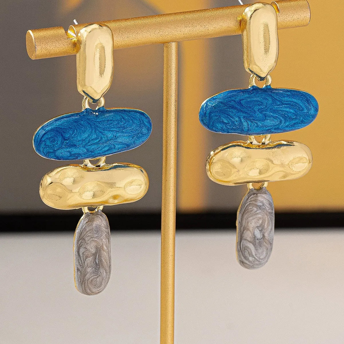 Geometric shaped stud earrings with multicolour electroplated finish on zinc alloy