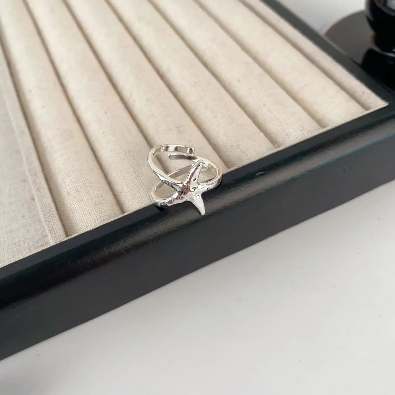 3D floral jasmine ring with heart, drop, and bell patterns on an adjustable open band.
