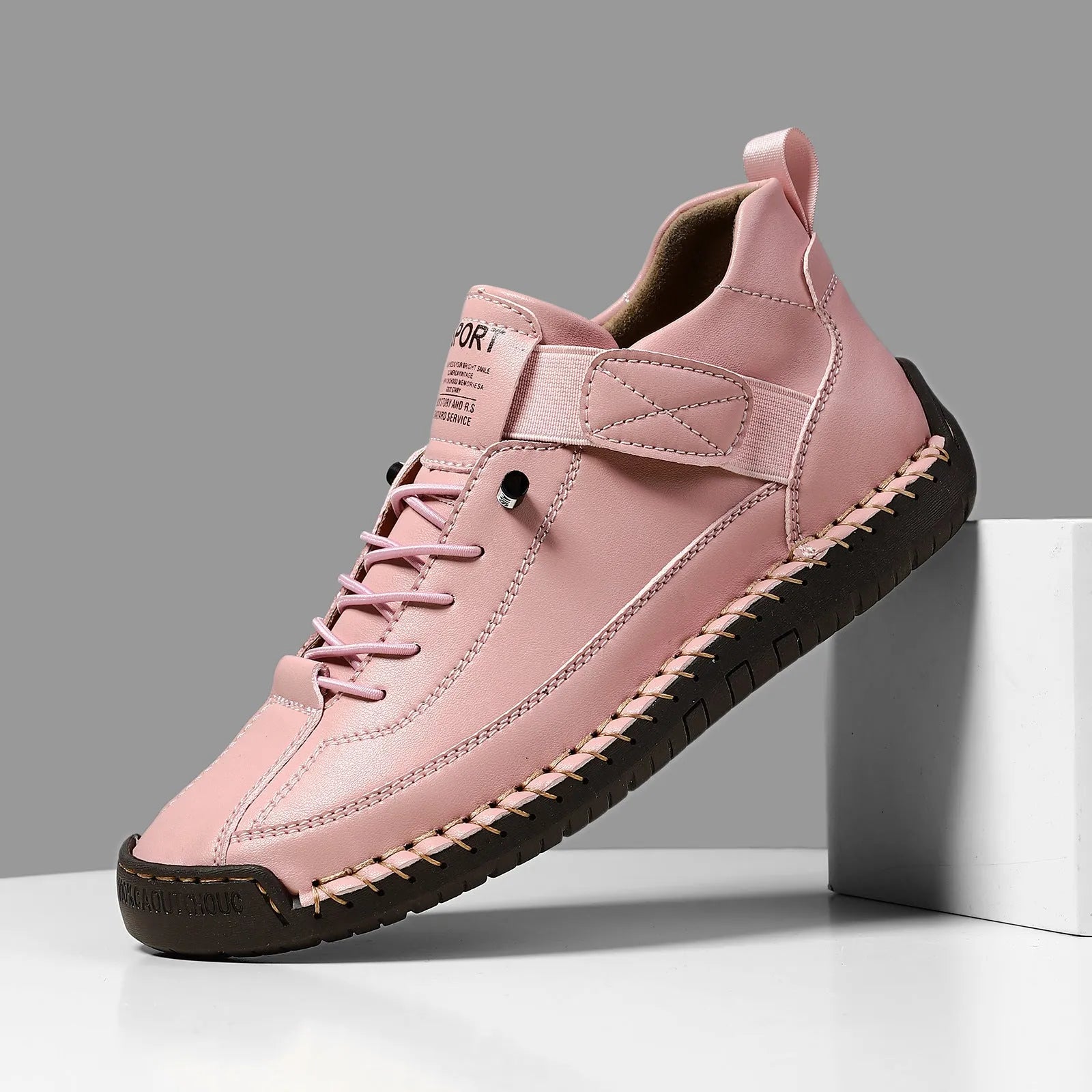 Men's mid-top Martin boot in khaki colour with tooling stitching on the rubber sole.